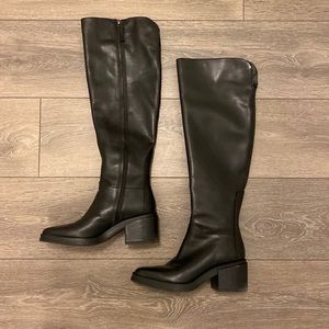 Black knee-high boots.